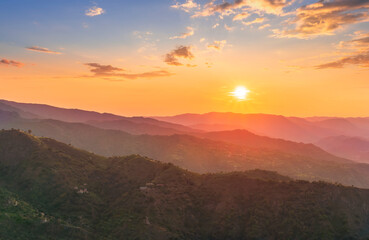 summer scenery mountain view from a highland hill to a beautiful sunset.