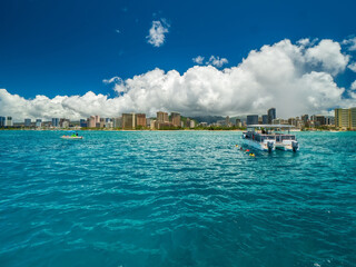 Pacific Ocean boat view with Honolulu at the background 