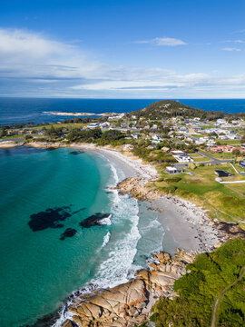 Bicheno, Tasmania: Aerial drone view of the beach at Bicheno coastline with a rainbow close to the famous Coles bay in Tasmania in Australia.
