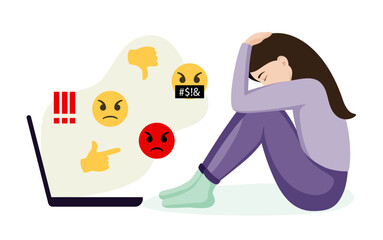 The unhappy woman is depressed. The concept of cyberbullying, the bad influence of the Internet. The victim of online bullying is sitting in front of a laptop, covering his face with his hands.
