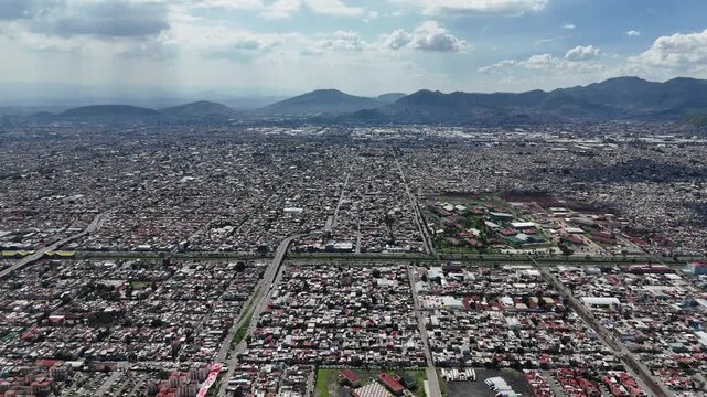 Aerial video from high altitude of Ecatepec, highlighting urban sprawl in CDMX metropolitan area