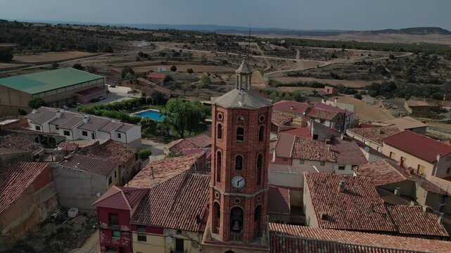 The village of la mata de los olmos, teruel, with a prominent clock tower , aerial view