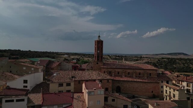 La mata de los olmos village in teruel, spain under a partly cloudy sky, aerial view