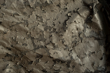 Damaged dark synthetic leather sofa. Old cracked damaged leather on synthetic leather sofa...