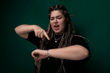 Woman With Dreadlocks Pointing at Something