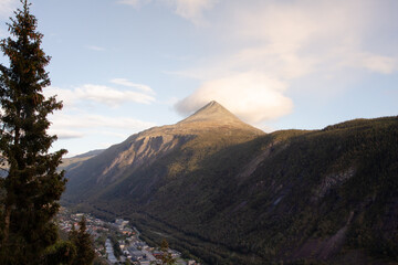 View cloud over tall mountain is impressive, Gaustatoppen and town Rjukan, City ​​in the valley Norway, Summer landscape