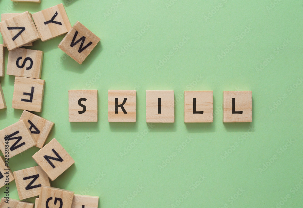 Poster a stack of wooden blocks forms a pile, with the word skill inscribed on one block, representing the 
