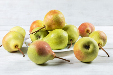 Fresh pear fruit on plate with white table, Healthy fruit