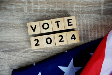 Vote 2024, Presidential Election with USA American flag on wooden background