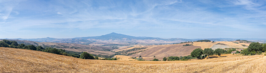 Val D'Orcia, Tuscany, Italy. Amazing landscape of the agricultural fields with gold and yellow colors. Earth's line. A perspective of the ground's colors and shapes