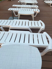 Deck chairs by an outdoor pool at a luxury resort