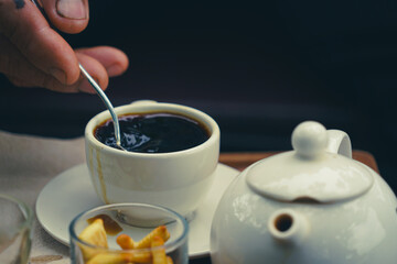 the black coffee in the cup with dramatic tone