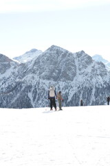 Skiing in the Dolomites stock photo. Snow covered mountain with ski slope in a European ski resort against a blue cloudy sky. Nature, beautiful views. Vacation. Travel content