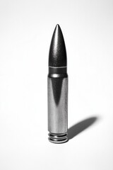 Bullet on White Surface