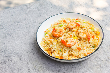 a plate of shrimp fried rice