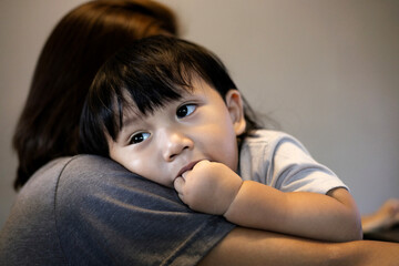 Little Boy Putting Fingers In His Mouth