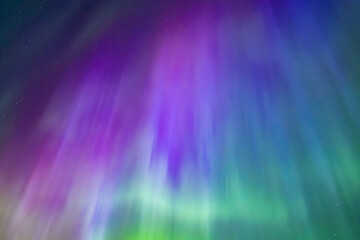 Northern lights dancing over dark sky