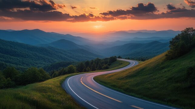 A winding asphalt highway stretching through lush green mountains under a dramatic sunset sky, with vibrant clouds, capturing the beauty of a serene road journey.