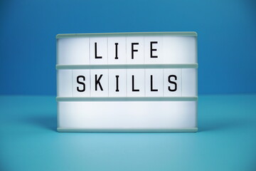 Life Skills letterboard text on LED Lightbox on blue background