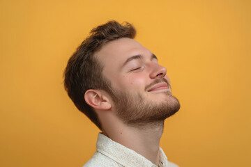 Obraz premium A close up of a man's face with his eyes closed
