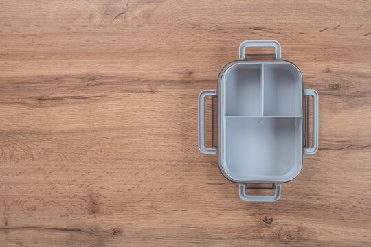 Empty lunch box on a wooden background. top view. copy space