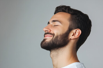 Fototapeta premium A close up of a man's face with his eyes closed