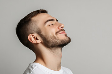 Fototapeta premium A close up of a man's face with his eyes closed