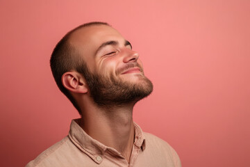 Obraz premium A close up of a man's face with his eyes closed