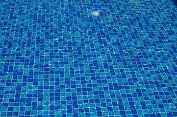 Swimming Pool Surface With Light Reflection and Water Ripple Patterns