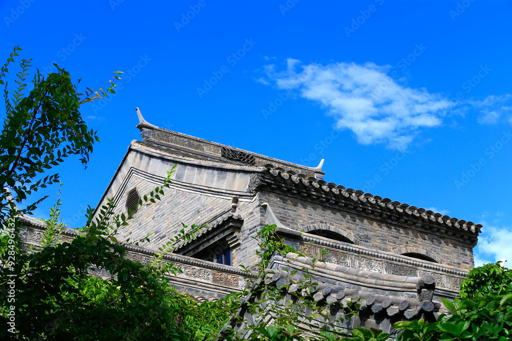 Wall mural beautiful ancient buildings, under the blue sky and white clouds