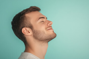 Fototapeta premium A close up of a man's face with his eyes closed