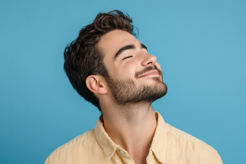 Fototapeta premium A close up of a man's face with his eyes closed