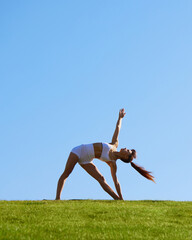 Quiet moment in nature, stretching or yoga outdoors, immersing in harmony and relaxation as body...