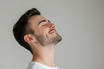 Fototapeta premium A close up of a man's face with his eyes closed