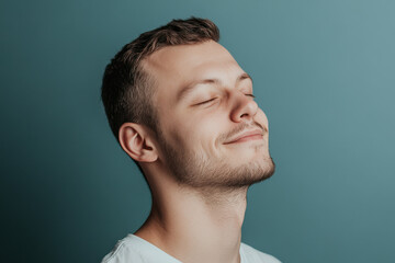 Fototapeta premium A close up of a man's face with his eyes closed
