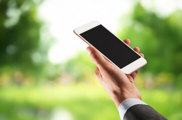 Hand holding smart phone with blank screen