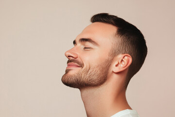 Fototapeta premium A close up of a man's face with his eyes closed