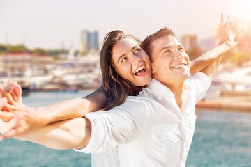 Obraz premium Happy couple of young tourists outdoor