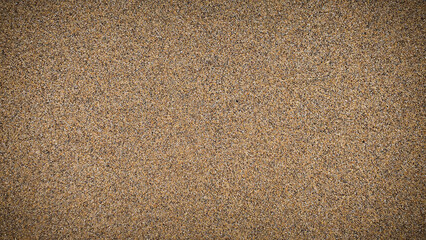 Natural grainy sand texture background in 4K resolution, perfect for use in design projects, websites, and banners. The image features shades of brown and beige with a natural, earthy feel