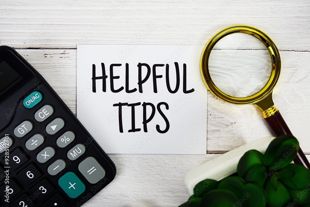 Poster helpful tips text message with calculate and magnifying glass top view on wooden background