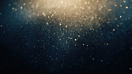 Fototapeta premium Abstract Background of Golden Glitter on a Dark Blue Background