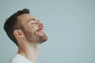 A close up of a man's face with his eyes closed