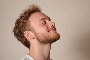 Fototapeta premium A close up of a man's face with his eyes closed
