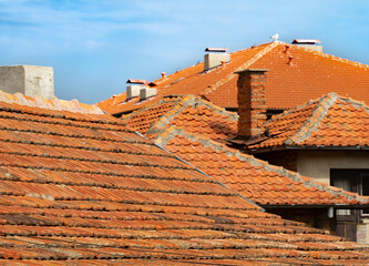 Tupical Bolgarian tile roof in the summer day