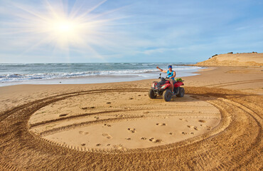 A young man explores the oceanfront on a quad bike near Essaouira, © Ryzhkov Oleksandr