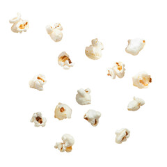 Flying or falling pieces of popcorn on a white or transparent background.