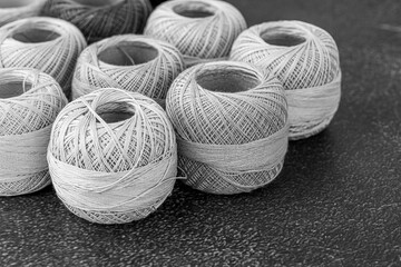 Multicolor yarn for knitting, knitting needles and scissors. Home storage concept and hobby.Raffia is an organic, ecological, wood fiber that is easy to crochet.