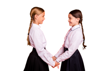 Profile side view of two person nice attractive charming cute lovely winsome adorable cheerful cheery friendly pre-teen girls holding hands isolated over bright vivid shine orange background
