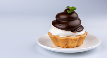 chocolate cake with cream on grey background