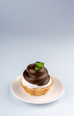 chocolate cake with cream on grey background